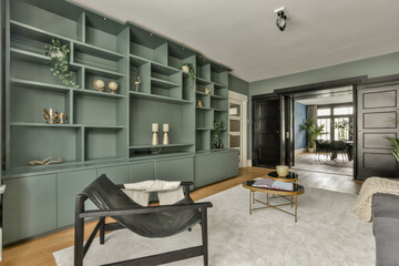 Modern living room with built-in shelving at Beethovenstraat 122-1