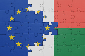 puzzle with the colourful national flag of madagascar and flag of european union.