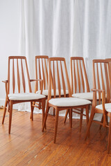 Vintage 1960s Dining Chairs. Chunky white textured upholstery on stylish Mid-Century Modern chairs. Photographed in a home interior. 