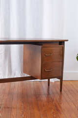 Mid-Century Modern Desk. Vintage walnut office furniture. Photographed in a home interior. 