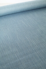 Soft blue heathered pattern. Vintage woven upholstery fabric texture. Close-up detail photograph.