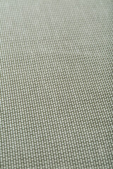 Grey, sage green, tight weave upholstery fabric texture. Close-up detail photograph.