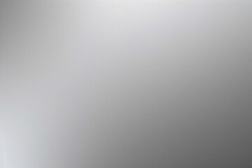 A tight shot of a polished metal surface adorned with a silver pattern, overlain by silver metallic foil
