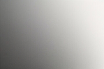 A tight shot of a polished metal surface adorned with a silver pattern, overlain by silver metallic foil
