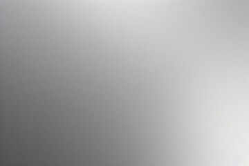 A tight shot of a polished metal surface adorned with a silver pattern, overlain by silver metallic foil
