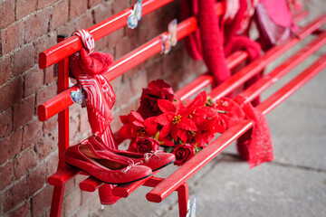 Red shoes on bench against violence against women