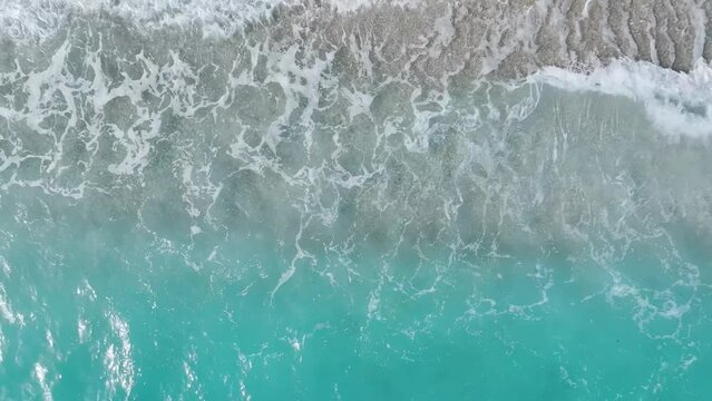 Top Down over Waves and Beach in Himare from a drone, Albanian Riviera, Albania