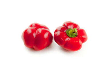 Two red bell pepper isolated on white background with clipping path. .