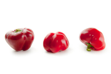 Three red bell pepper isolated on white background with clipping path. .