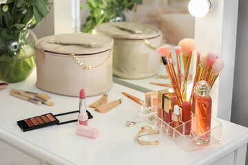 Decorative cosmetics on table in dressing room, closeup
