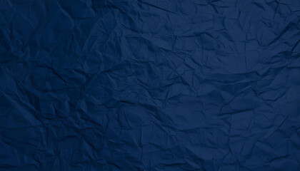 Crinkled dark blue paper texture background