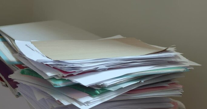 Large pile of papers dropped on floor, Too much work
