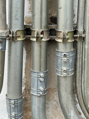 electric pipes on the old industrial wall