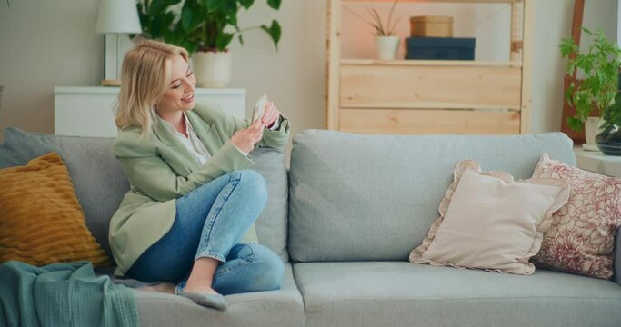 Happy Businesswoman Manages Business from Home