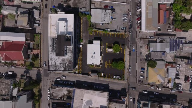 Discover Jamaica's urban streets from above with stunning aerial drone footage of Montego Bay, highlighting city's architecture, vehicles, and lively atmosphere