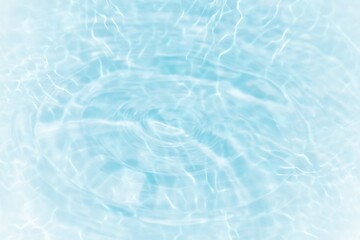 Blue water with ripples on the surface. Defocus blurred transparent blue colored clear calm water surface texture with splashes and bubbles. Water waves with shining pattern texture background.
