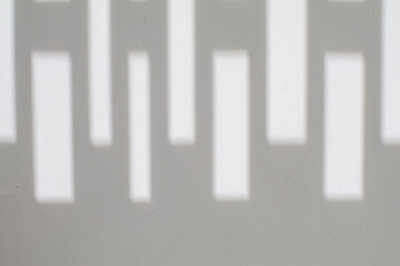 Abstract White empty wall with sunlight and shadow from window. Sunbeam in a room, sunny day...