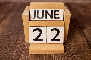 22 june wooden calendar in white background