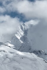 Winter high mountains in clouds