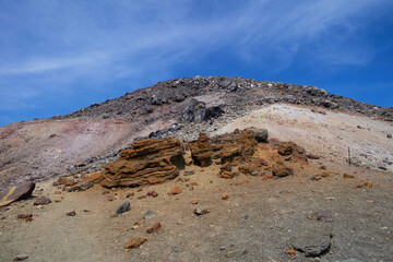 Volcanic rocky terrain and clear blue sky scenery