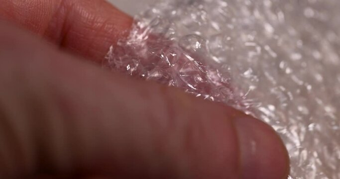 old air cellophane with a lot of bubbles for safe storage of things, close-up of a protective film with air bubbles