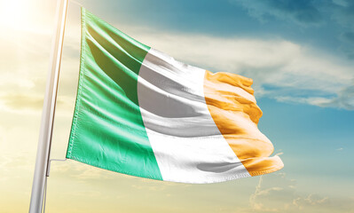 Ireland national flag waving in beautiful sky.