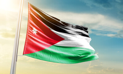 Jordan national flag waving in beautiful sky.