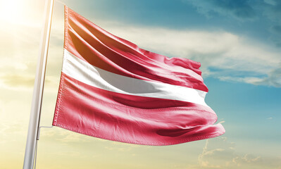 Latvia national flag waving in beautiful sky.