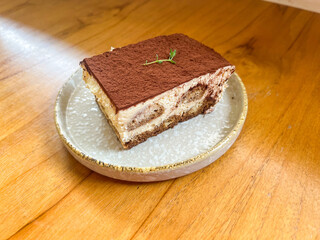 Tiramisu Cake is an Italian dessert made of ladyfinger pastries dipped in coffee.