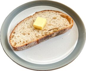 A piece of sliced sourdough bread on top with butter served on the plate with white background.
