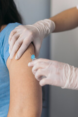 Nurse giving a vaccine to a patient
