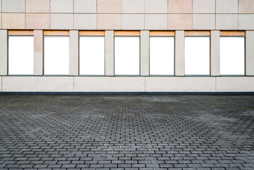 Line Of Blank Vertical Mockups Of Outdoor Poster Light Boxes On A Building Facade Wall. Front View