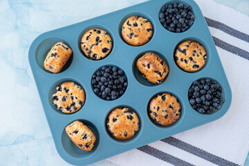 Berry pie in silicone muffin tin. Healthy vegan cupcakes with organic berries. Fresh baked blueberry muffins. Tasty Sweet cupcake. Pastry homemade dessert. Baked in reusable silicon forms