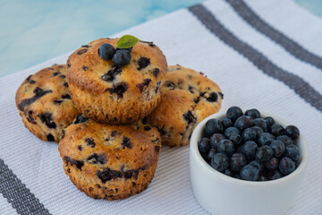 Homemade baked blueberry muffins with fresh blackberries. Tasty pastry sweet cupcake dessert. Berry pie Healthy vegan cupcakes with organic berries. Gluten free healthcare recipe from alternative