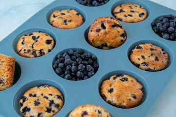 Fresh baked blueberry muffins. Tasty Sweet cupcake. Pastry homemade dessert. Berry pie in silicone muffin tin. Healthy vegan cupcakes with organic berries Baked in reusable silicon forms