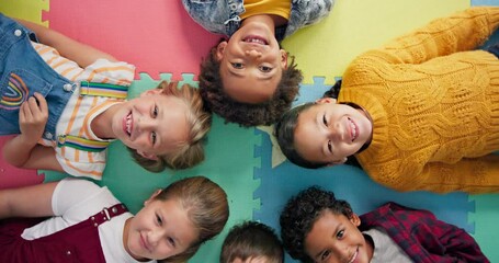 Happy, kids and laying in circle on mat in school with top view for relax, fun and portrait in class. Group, children and happy on floor for education, learning and knowledge with game for bonding - Powered by Adobe