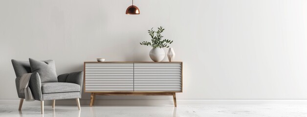 Minimalist design sideboard with gray stripes and a wooden leg in the center of an empty room, with white walls and a grey armchair on one end