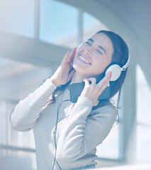 Woman, happy and headphones for dancing in home, subscription and online for kpop music. Female person, playlist and phone for audio, streaming and entertainment or listening to sound or jazz album