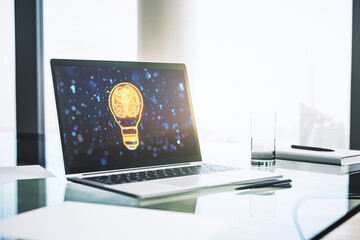Modern computer monitor with creative light bulb hologram with human brain, idea and brainstorming...