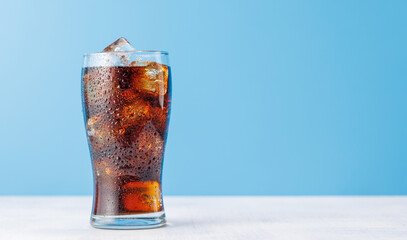 Cola with ice in glass