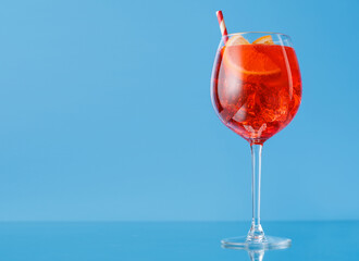 Aperol spritz cocktail with orange slice and ice