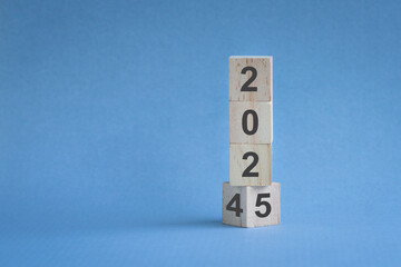 From 2024 to 2025. Numbers on vertical wood blocks. New year.