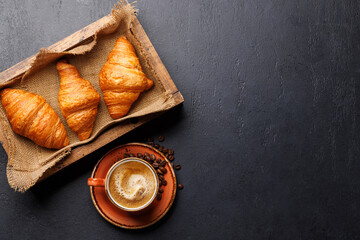 Cappuccino coffee and fresh croissants