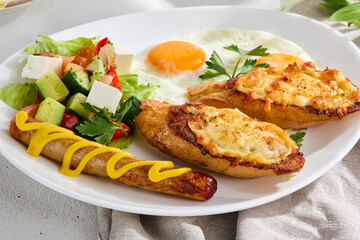 Hearty Combo Breakfast with Sunny-Side-Up Egg, Cheese Toasts, Sausage, and Vegetable Salad