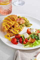 Appetizing Combo Breakfast with Bacon Croissant and Fresh Vegetable Salad