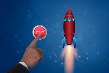 Businessman hand presses the big red start rocket launch button. Corporate business, Start up and...