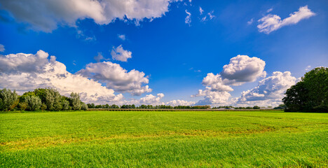 Grand cloudscape over a rustic landscape in The Netherlands.