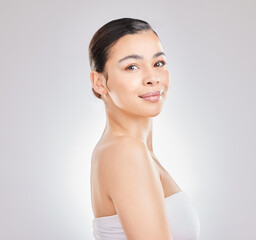 Woman, portrait and face for wellness, beauty and health in studio with skin glow or shine. Girl, smile and happy for self care, aesthetic and facial transformation on white background in Colombia