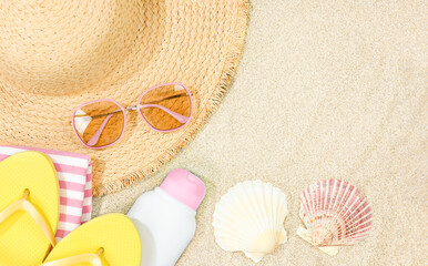 Summer Concept: Beach Accessories on Sandy Background