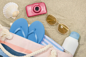 Summer Concept: Beach Accessories on Sandy Background